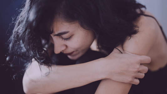 Hashimoto's and Depression; Woman sad with her arms crossed